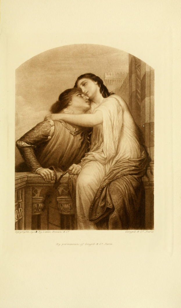 Zwei Personen auf einer Bank sitzend, die sich umarmen und küssen, mit Text unten auf dem Bild.