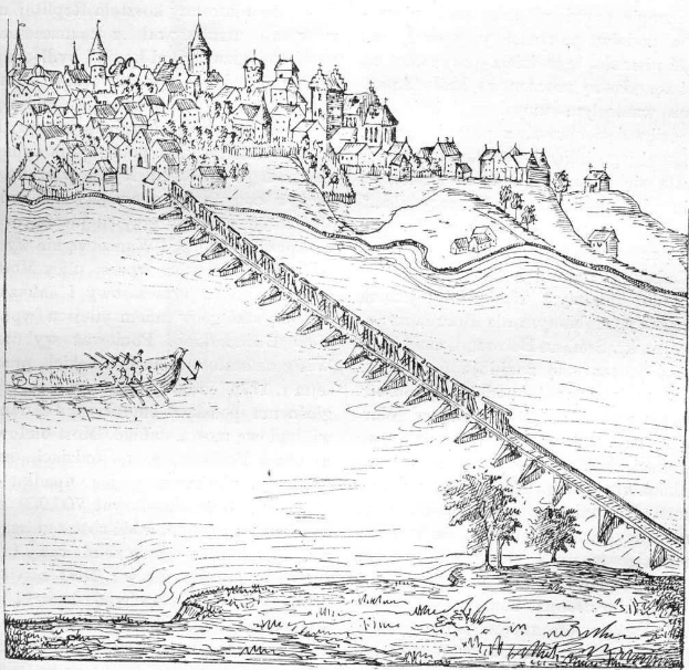 Eine Zeichnung einer Brücke, die einen Fluss überspannt, mit einem Schloss im Hintergrund, umgeben von Bäumen und einem Boot auf dem Wasser; unten steht der Text "Die Rheinbrücke in Deutschland."