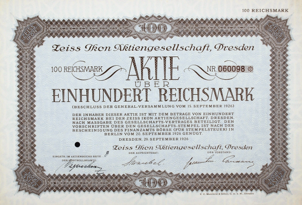 Altes deutsches Aktienzertifikat über einhundert Reichsmark mit schwarzem Rand und gedrucktem Text.